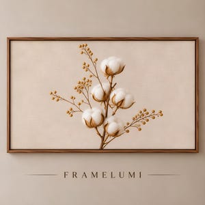 Könnte beinhalten: Ein rechteckiges Wandbild mit einem horizontalen Holzrahmen, der einen beigen Leinwanddruck eines Baumwollzweigs mit vier weißen Baumwollkapseln und zarten beigen Zweigen umschließt. Der Text FRAMELUMI ist darunter in Schwarz aufgedruckt.