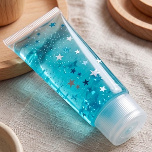 Tube de dentifrice bleu à presser, jouet anti-stress en gel pailleté, jouet sensoriel mignon pour le bureau, cadeau doux à presser pour les enfants