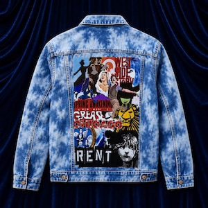 May include: A light blue acid-wash denim jacket featuring a large rectangular back patch printed with a collage of Broadway musical posters including West Side Story, Spring Awakening, Grease, Chicago, The Lion King, and Rent with bold text.