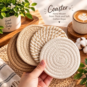May include: A set of four round coasters hand-woven from thick, soft cotton rope in shades of solid brown, beige, and a two-tone beige and white spiral pattern. The text on the image reads: Coaster, Hand Woven from Thick and Soft Cotton Rope.