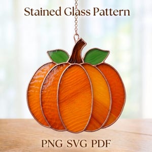 May include: A stained glass pumpkin suncatcher featuring orange glass segments, a brown stem, and two green leaves, suspended by a metal chain. The text Stained Glass Pattern and PNG SVG PDF is visible above and below the pumpkin ornament.
