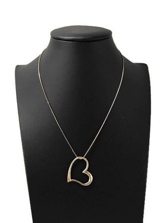 Zales Open Hearts Family by Jane Seymourâ„¢ Birthstone and Diamond Accent Angel  Pendant in 10K Gold (1 Stone) | CoolSprings Galleria