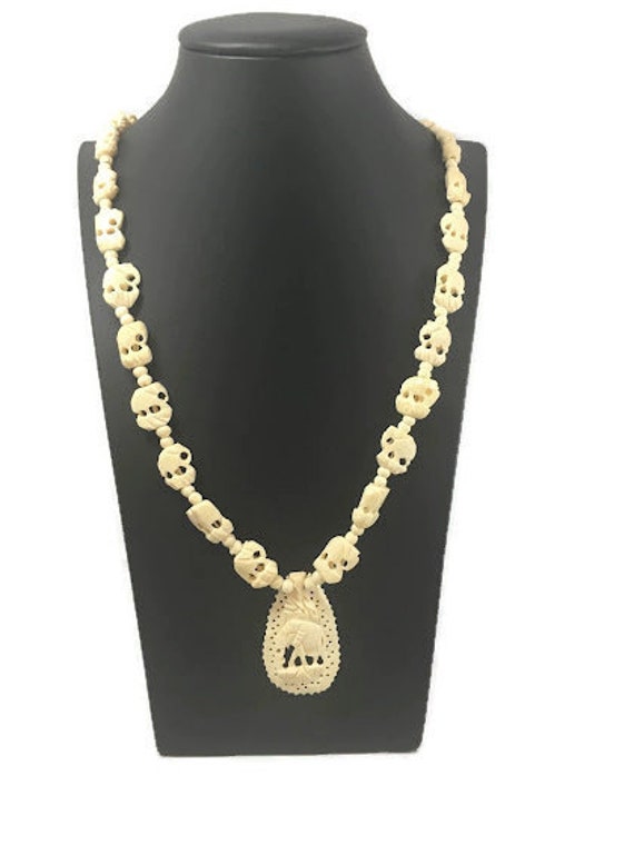 Ivory elephant best sale necklace