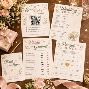 May include: A collection of printed wedding shower game cards including Wedding Trivia, Bride or Groom, and Bridal Bingo, alongside a Scan to Play QR code card and a Thank You card, all featuring floral accents and gold heart details on white paper.