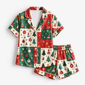 May include: A short-sleeve button-down pajama shirt and matching shorts set featuring a patchwork pattern of red, green, and cream squares. The print includes illustrations of Christmas trees, ornaments, stars, and Santa hats with white piping.