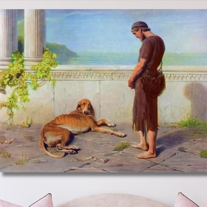 Puede incluir: Una impresión de arte mural enmarcada que representa una pintura clásica de una persona descalza con túnica marrón de pie ante un perro marrón tumbado en una terraza de piedra. La escena incluye una columna de piedra con enredaderas verdes.