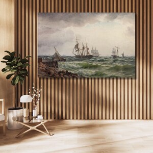 May include: A rectangular wall art print depicting a seascape with multiple sailing ships on choppy, dark green waves under a cloudy, overcast sky. A stone pier extends into the water from the left side, with muted tones of gray, brown, and green.