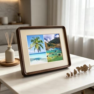 May include: A rectangular dark wood picture frame with rounded corners and a cream-colored mat. The frame holds two side-by-side photographs: one showing a palm tree on a beach and the other displaying terraced turquoise pools in a mountain landscape.