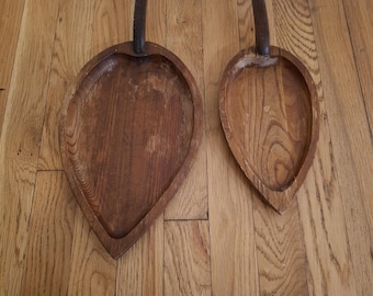 Vintage hand-carved wooden leaf-shaped serving trays.