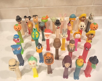 Thirty-three collectable Pez Containers.