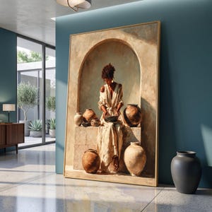 May include: A large rectangular framed wall art piece depicting a person in a light-colored robe sitting within a stone archway, surrounded by several rounded clay pottery vessels in various shades of brown, tan, and beige earth tones.