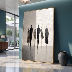 May include: A large vertical framed painting featuring six abstract, elongated black figures standing against a textured, light gray and white background. The composition uses a neutral color palette with sharp, minimalist silhouettes that create a sense of depth and movement across the canvas surface.