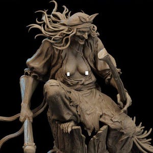 May include: A brown monochromatic figurine of a witch-like figure with long flowing hair, wearing a headscarf and tattered clothing, sitting atop a wooden barrel. The figure holds a staff and is positioned on a base of logs, roots, and small stones.