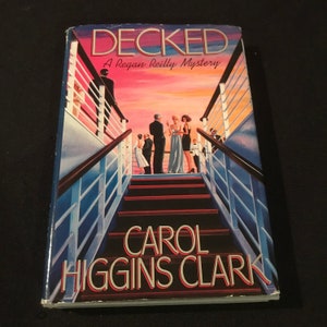 Vintage Decked: A Regan Reilly Mystery book by Carol Higgins Clark - Large Print - 1992 - from DustyMillerAntiques