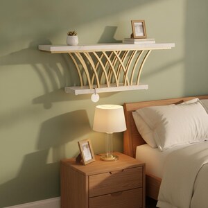 May include: A wall-mounted shelf featuring a white marble-patterned top and bottom surface connected by curved gold-toned metal supports. The shelf is mounted on a wall above a wooden nightstand and a lamp, providing a display area for items.