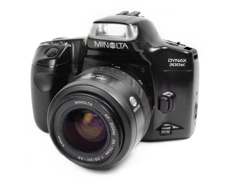 Vintage SLR 35mm Film Camera with 35-70mm Zoom Lens Minolta Dyna Vintage SLR 35mm Film Camera with 35-70mm Zoom Lens Minolta Dyna
