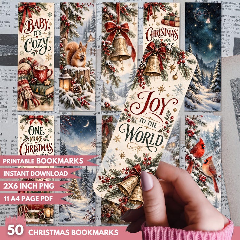 May include: A collection of rectangular Christmas-themed bookmarks featuring various winter scenes including a squirrel, bells, cardinals, and snowy landscapes. Text includes Baby It's Cozy, Christmas, and Joy to the World. One bookmark is held by a hand.