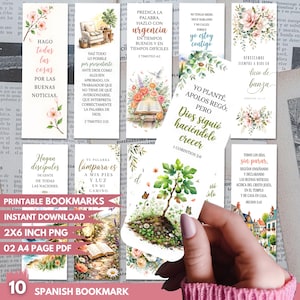 May include: A collection of ten rectangular paper bookmarks featuring floral illustrations, landscape scenes, and religious text in Spanish. The designs include watercolour flowers, a small tree, a house, and an open book, all printed on white paper.