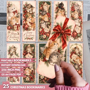 May include: A collection of rectangular bookmarks featuring illustrations of kittens, Christmas trees, poinsettias, and red ribbons. Several bookmarks include the text Happy Christmas. One bookmark is held, showing a ginger and a grey kitten.