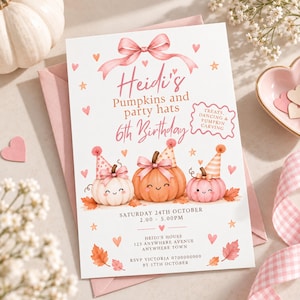 May include: A white birthday invitation card featuring a pink bow at the top, three smiling pumpkins wearing party hats, and autumn leaves. The text reads: Heidi's Pumpkins and party hats 6th Birthday, Treats, Dancing & Pumpkin Carving, Saturday 24th October, 2.00 - 5.00pm, Heidi's House, 123 Anywhere Avenue, Anywhere Town, RSVP Victoria 0700000000 by 17th October.