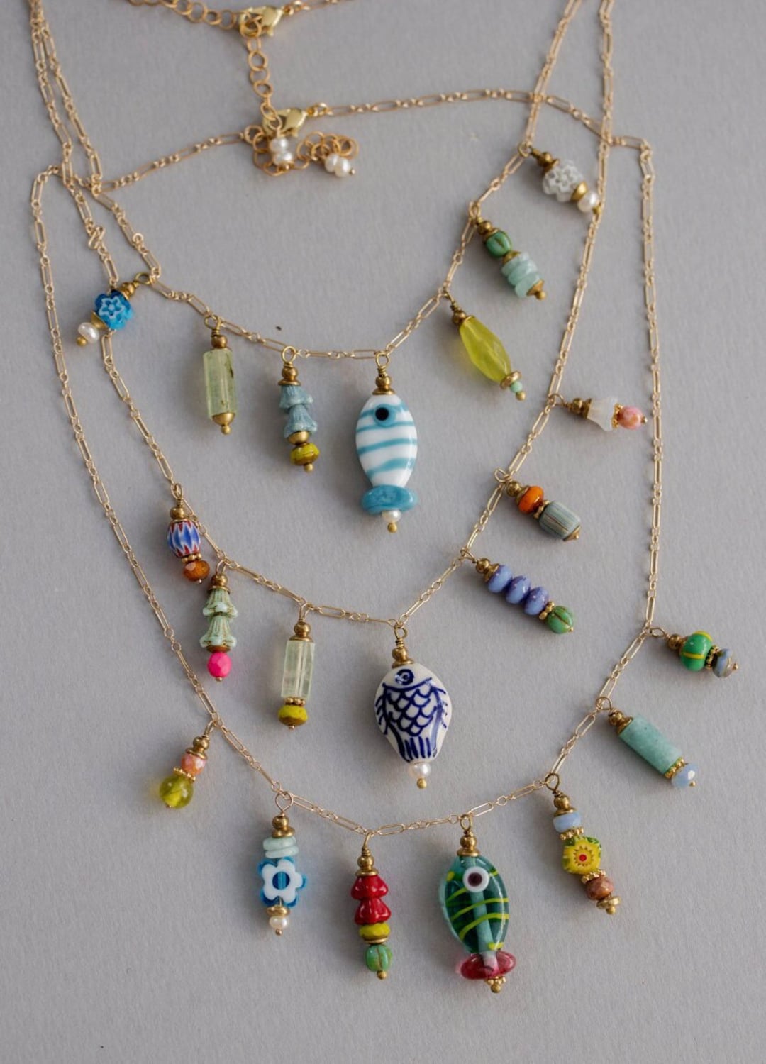 BEADED FISH CHARM NECKLACE