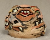 Monstrosity Creamer - Eight-faced, wheel thrown, hand altered and sculpted creamer.  Just a friendly face to enjoy with your coffee with.