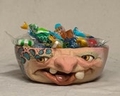 REALLY SMALL BOWL-Wheel thrown, hand altered & sculpted. Just a friendly face to hold a dieters portion of ice cream, Q Tips, or candy.