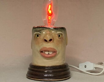 FLICKER CANDLE- Ready to ship- wheel thrown, hand altered and sculpted. A happy fella to help light up your life. Makes a great nightlight.