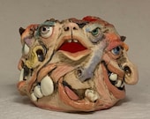 Monstrosity Creamer - Eight-faced, wheel thrown, hand altered and sculpted creamer.  Just a friendly face to enjoy with your coffee with.