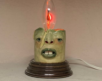 FLICKER CANDLE- Ready to ship- wheel thrown, hand altered and sculpted. A happy fella to help light up your life. Makes a great nightlight.