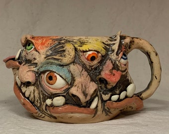Monstrosity Creamer - Eight-faced, wheel thrown, hand altered and sculpted creamer.  Just a friendly face to enjoy with your coffee with.