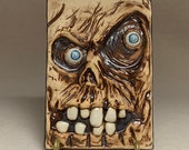 SCULPTED TILE - Hand sculpted tile. What a cute little guy to hang on your wall at Halloween or all year long.