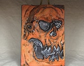 SCULPTED TILE - Hand sculpted tile. What a cute little guy to hang on your wall at Halloween or all year long.
