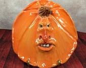 PUMPKIN PLATE - Wheel thrown, hand altered and sculpted ceramic plate or wall hanging. A friendly face to enjoy for the holiday season. PP4
