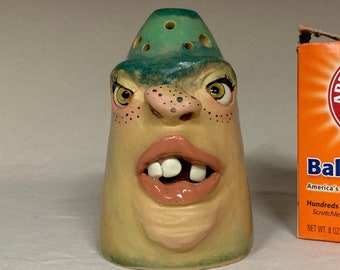 SMELLY EATER  - wheel thrown, hand altered and sculpted. What a cute face to take away those smelly things in your refrigerator.