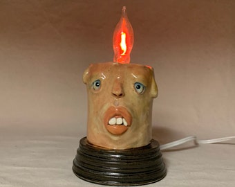 FLICKER CANDLE- Ready to ship- wheel thrown, hand altered and sculpted. A happy fella to help light up your life. Makes a great nightlight.