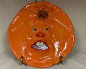 PUMPKIN PLATE  -Wheel thrown, hand altered and sculpted ceramic plate or wall hanging. Just a friendly face to enjoy for the holiday season.