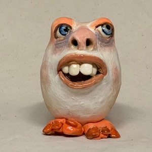 Egg Head Rattler - Slab built, hand altered and sculpted ceramic gazing ball. Just a friendly face to enjoy in your home.