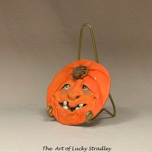 SAUCER Pumpkin. Wheel thrown, hand altered and sculpted ceramic saucer or wall hanging. A friendly face to enjoy for the holiday season. image 2