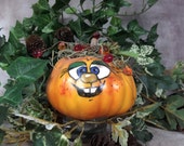 PAINTED FANCY PUMPKIN - Painted and decorated hard foam pumpkin. Just a friendly face to brighten your day for Halloween and Thanksgiving.