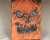 SCULPTED TILE - Hand sculpted tile. What a cute little guy to hang on your wall at Halloween or all year long.