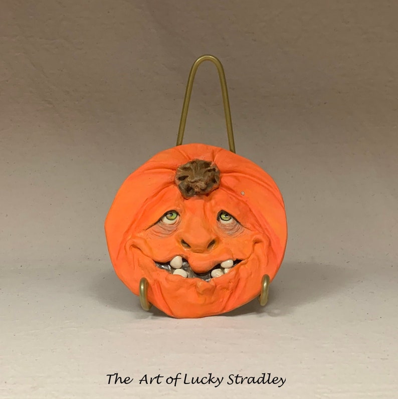 SAUCER Pumpkin. Wheel thrown, hand altered and sculpted ceramic saucer or wall hanging. A friendly face to enjoy for the holiday season. image 1