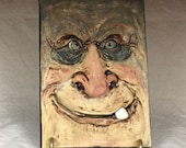 SCULPTED TILE - Hand sculpted tile. What a cute little guy to hang on your wall at Halloween or all year long.