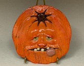 PUMPKIN PLATE Wheel thrown, hand altered and sculpted ceramic plate or wall hanging. A friendly face to enjoy for the holiday season.