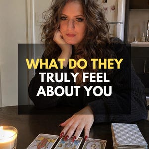 May include: A person with long wavy brown hair wearing a black jumper sits at a table with tarot cards and a lit candle. The text WHAT DO THEY TRULY FEEL ABOUT YOU is overlaid in yellow and white. The person has long red fingernails.