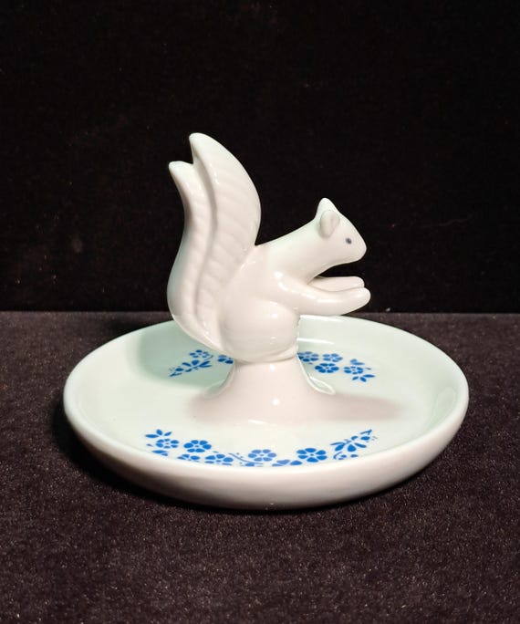 vintage-style squirrel trinket dish features a delicate white porcelain squirrel