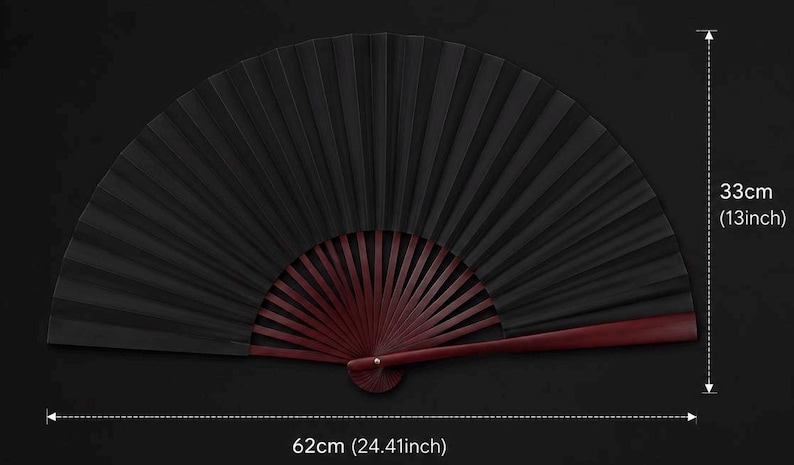 May include: A black folding hand fan with dark red wooden ribs. The fan measures 13 inches in height and 24.41 inches in width when fully opened. The text 33cm (13inch) and 62cm (24.41inch) is visible on the image indicating the dimensions.