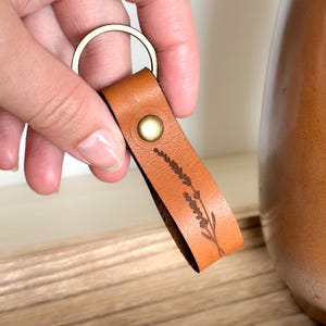 Personalized Leather Keychain – Lavender Line Art Design with Custom Text | Minimal Key Ring for Women | Handmade Everyday Gift