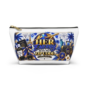 May include: A white zippered pouch featuring a travel-themed graphic with a globe, airplane, Eiffel Tower, Statue of Liberty, passport, sunglasses, and luggage. The text reads HER ENERGY HAS NO ZIP CODE, ALREADY HER CO, HER IS A LIFESTYLE.