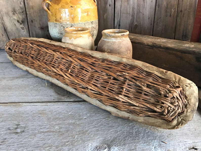 Rustic long vintage French baguette bread proofing basket from France. French Country Basket Inspiration: Resources for Rustic, French Market, and Boulangerie as well as photos to Inspire!